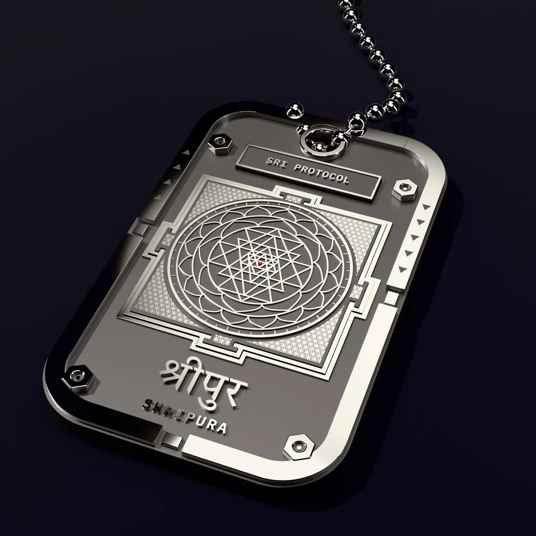 Concept render: the Sri Protocol tag in oxidised silver on a ball chain, a machined frame with hex bolts around the whole Śrī Cakra drawn in raised lines, with a small ruby at the centre